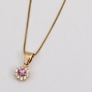 Dije Flor Oro Amarillo y Zafiro Rosado